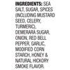 A close-up of the ingredients list for a package of Stubb'S, 5.04 Oz, detailing components such as sea salt, sugar, spices, and natural hickory smoke flavor.