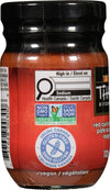 A jar of Thai Kitchen Red Curry Paste Curry 4 Oz is shown, featuring its nutrition facts and certifications