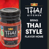 A jar of Thai Kitchen red curry paste with a background of the Thai Kitchen logo and the phrase Bring Thai Style Flavor Home.