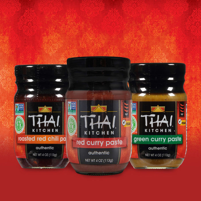 Three jars of Thai Kitchen curry paste roasted red chili paste and green curry paste.