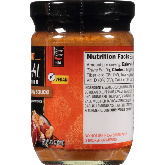 A bottle of Thai Kitchen Satay Sauce with a label that says mild and vegan.