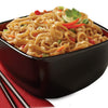 A bowl of delicious-looking Pad Thai noodles with vegetables and peanuts, garnished with a lime wedge and cilantro.