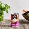 A can of Thai Kitchen Coconut Cream, unsweetened, on a wooden table.