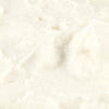 A close-up of a white, creamy substance.