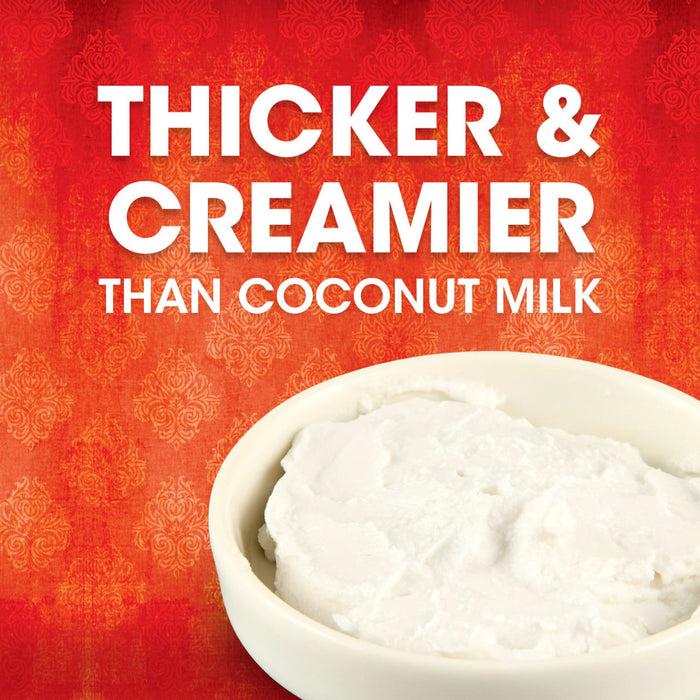 A bowl of white, creamy coconut milk with the text 'Thicker &amp; Creamier Than Coconut Milk' on a red background.