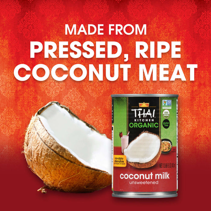A can of Thai Kitchen Organic Coconut Milk is displayed next to a halved coconut, emphasizing that the product is made from pressed, ripe coconut meat.