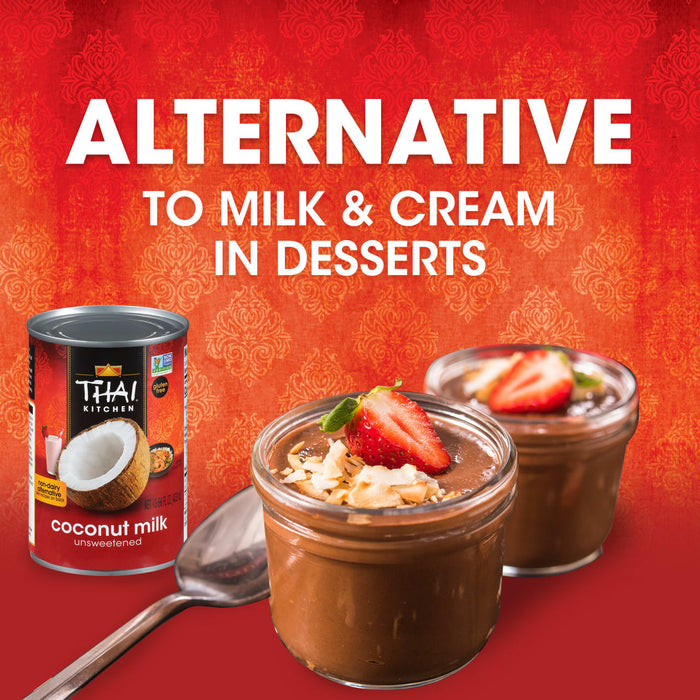 A can of Thai Kitchen unsweetened coconut milk next to two jars of chocolate pudding topped with coconut flakes and strawberries.