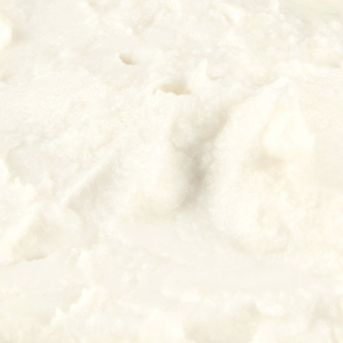 Close-up of a creamy, white, textured dairy product.
