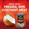 Thai Kitchen coconut milk is made from pressed, ripe coconut meat, as shown next to a halved coconut.