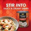 A can of Thai Kitchen coconut milk is featured alongside a bowl of creamy shrimp dish, promoting its use in saucy and creamy recipes.