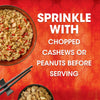 A serving suggestion for a Thai Kitchen, 9.0 Oz meal shows a bowl of chicken and rice, with text recommending to sprinkle with chopped cashews or peanuts before serving.