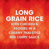 A promotional graphic for Thai Kitchen, 9.0 Oz features bold white text on a red patterned background describing the product as Long grain rice with chicken &amp; veggies in a creamy Thai-style red curry sauce.
