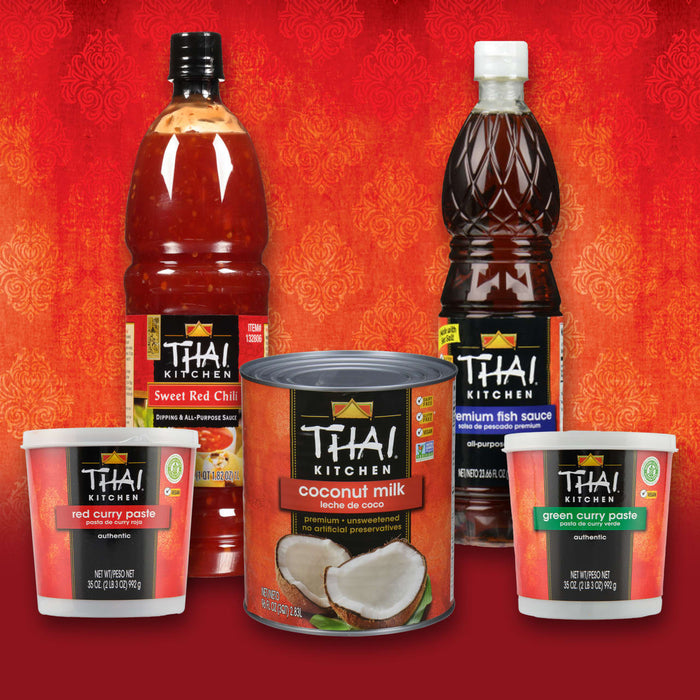 A collection of Thai Kitchen brand products including sweet chili sauce, fish sauce, coconut milk, red curry paste, and green curry paste are displayed against a red background.