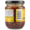 A glass jar of Bold Szechuan Flavored Chili Oil with a yellow label and a barcode.