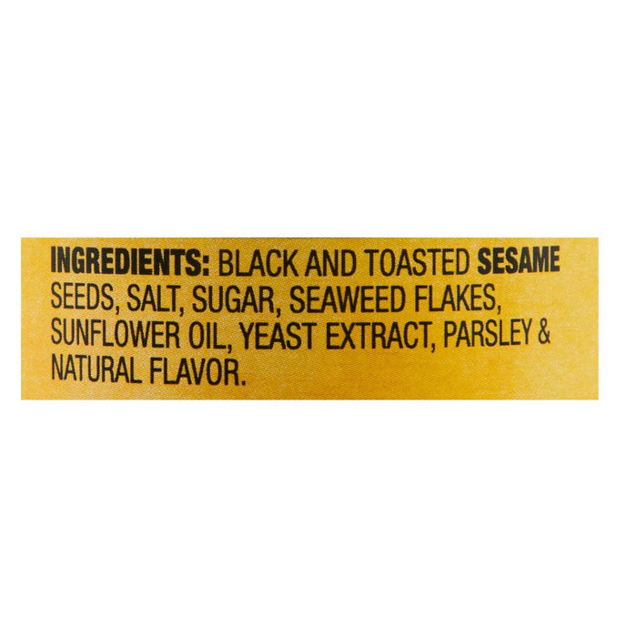A yellow label with black text listing the ingredients for a product containing black and toasted sesame seeds.