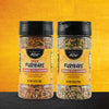 Two containers of First Field Furikake seasoning, one spicy and one original, are displayed against a textured background.