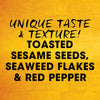 The image highlights the unique taste and texture of a product, featuring toasted sesame seeds, seaweed flakes, and red pepper.