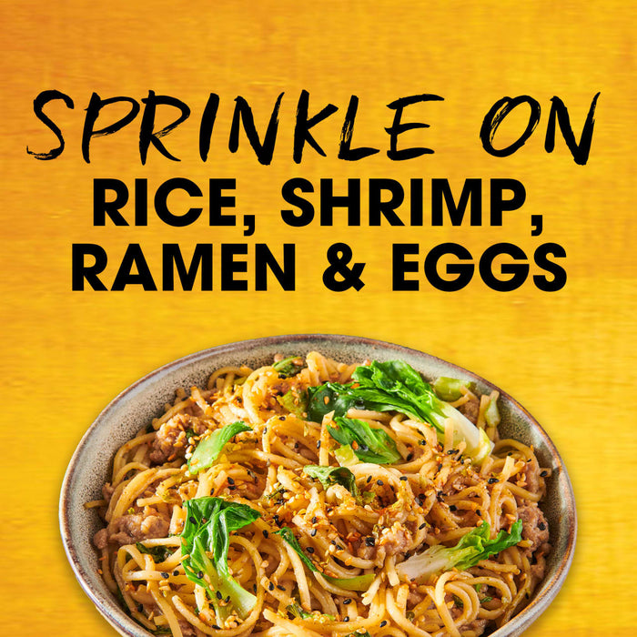 A bowl of ramen with the text Sprinkle on rice, shrimp, ramen &amp; eggs.