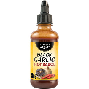 A bottle of Humble House Black Garlic Hot Sauce is shown, highlighting the brand and product.