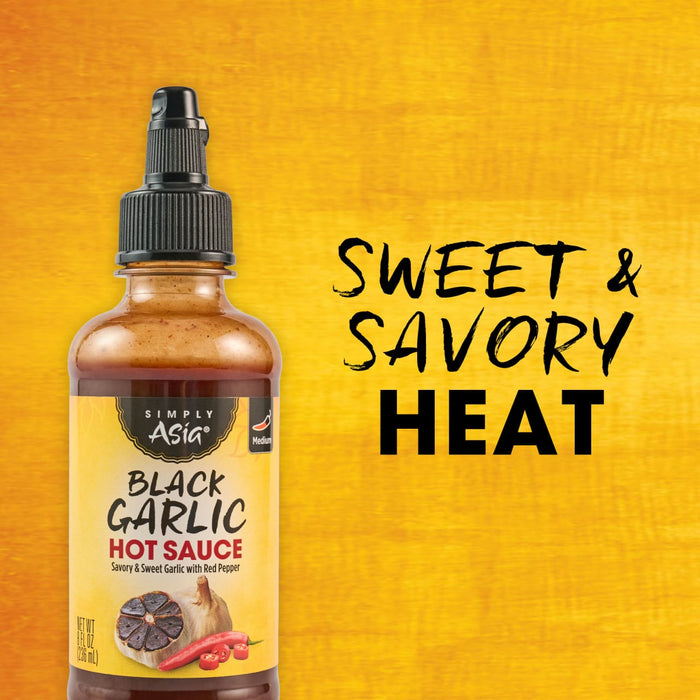 A bottle of Flavor Noir Black Garlic Hot Sauce is displayed, highlighting its sweet and savory heat.