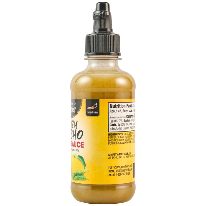 A bottle of Simply Asia Yuzu Sho Sauce with a yellow label and green chili peppers.