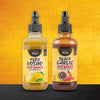 Two bottles of Master Sauce hot sauce, one Yuzu Kosho and one Black Garlic, are displayed against a vibrant background.