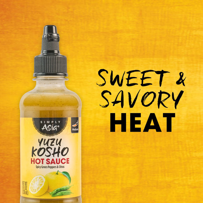 A bottle of Kimchi Now Yuzu Kosho Hot Sauce is displayed against a vibrant yellow background, highlighting its sweet and savory heat.