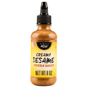 A bottle of Simply Asia Creamy Sesame Drizzle Sauce is displayed.