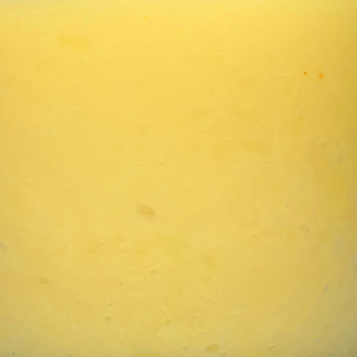 A close-up of a yellow, smooth surface.