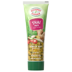 Gourmet Garden Thai Seasoning Paste tube with a green background and ingredients.