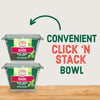 Two containers of Gourmet Garden Chopped Basil, representing the Gourmet Garden Basil (Case Of 72) product, are shown stacked to highlight their convenient 'Click 'N Stack' bowl design, with a green arrow illustrating the stacking action.