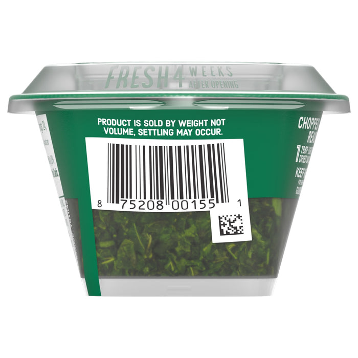 The back of a container of Gourmet Garden Basil Seasoning Whole .42 Oz displays the barcode and a statement that the product is sold by weight, not volume.