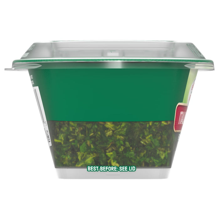 A side view of the Gourmet Garden Italian Herb Seasoning Chopped .35 Oz container, showing the chopped herbs through the clear bottom half of the packaging.