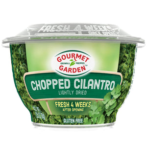 A container of Gourmet Garden Chopped Cilantro a lightly dried product that is fresh for 4 weeks after opening.