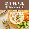 A tube of Amore Caramelized Onion Paste is displayed next to a bowl of dip surrounded by vegetables, with the text Stir-in, Rub, or Marinate above.