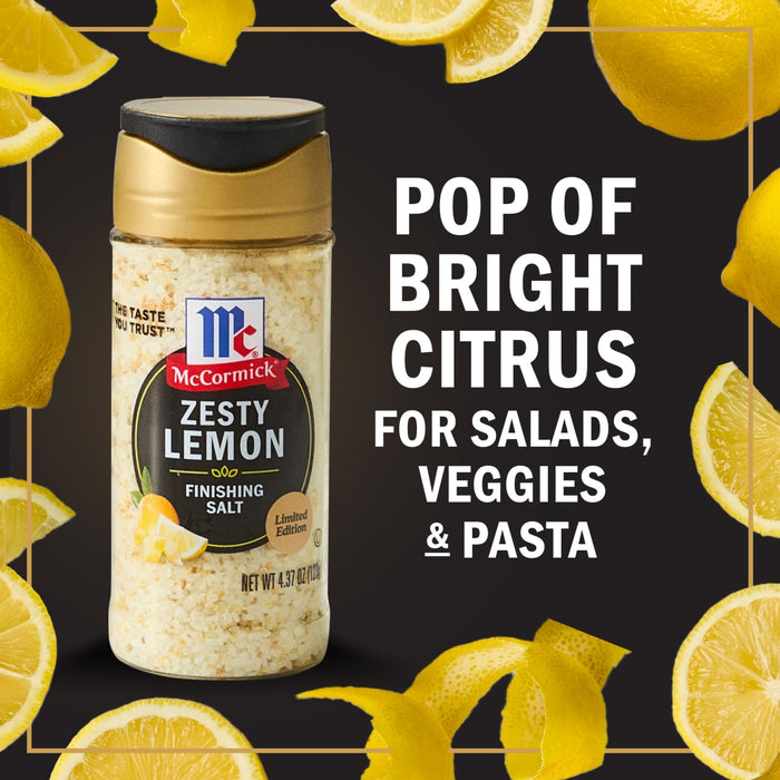 A jar of McCormick Zesty Lemon Finishing Salt with lemons and lemon peels around it.