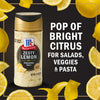 A jar of McCormick Zesty Lemon Finishing Salt with lemons and lemon peels around it.