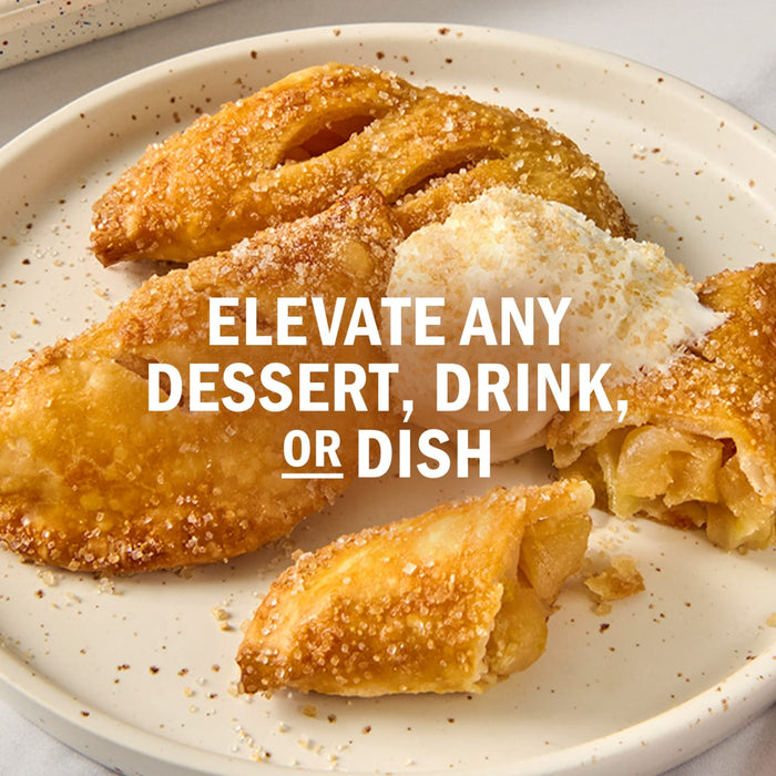 Fried apple pies are arranged on a plate with a scoop of ice cream, accompanied by the text Elevate any dessert, drink, or dish.