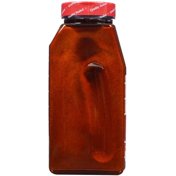A brown glass bottle with a red lid that says Quality Sealed.