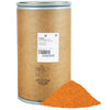 A brown paper bag with a label that says LWY Seasoned Salt 180 LB, with a pile of orange salt in front of it.