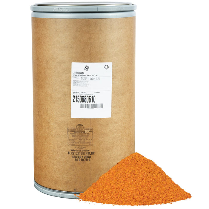 A brown paper bag with a label that says LWY Seasoned Salt 180 LB, with a pile of orange salt in front of it.