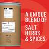 A large container of a unique blend of salt, herbs, and spices is shown against a red background with a circular pattern.