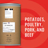 A large container of dehydrated food ingredients, suitable for potatoes, poultry, pork, and beef, is displayed against a red background.