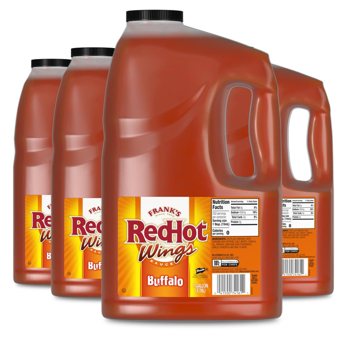 Four large, one-gallon jugs of Franks Red Hot Original Buffalo Wing Hot Sauce Red Hot 128 Oz are arranged in a row against a white background.
