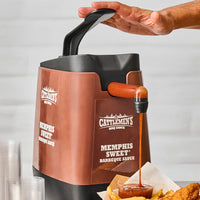 Cattlemen's Memphis Sweet Barbecue Sauce dispenser being used to pour sauce into a small bowl.