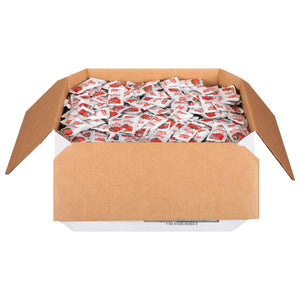 A box full of Frenchs Tomato Ketchup single-serving packets.