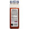 A McCormick for Chefs Sriracha Seasoning jar with nutrition facts and ingredients listed on the label.