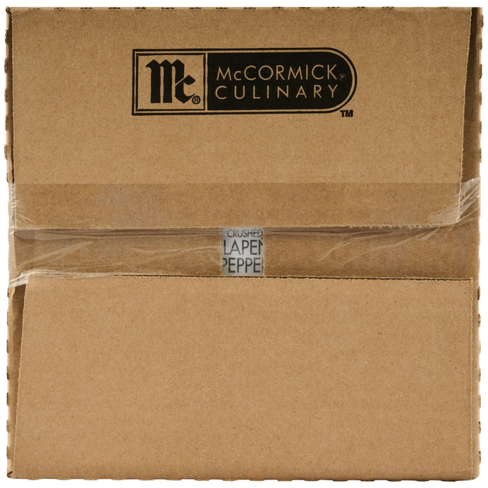 A top-down view of a sealed cardboard shipping case for Mccormick Culinary Crushed Jalapeno Pepper, 11.28 Oz, showing the brand logo and product name on the tape.