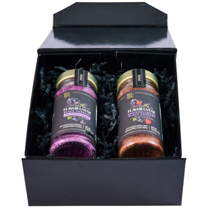 A black gift box displays two McCormick Flavor of the Year 2026 products, including the Mccormick Culinary Sweet &amp; Smoky Naturally Flavored Black Currant Seasoning and a Black Currant Finishing Sugar, nestled in black paper shred.
