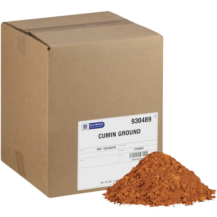 A large cardboard box of Mccormick Culinary Ground Cumin sits next to a pile of the reddish-brown spice powder.